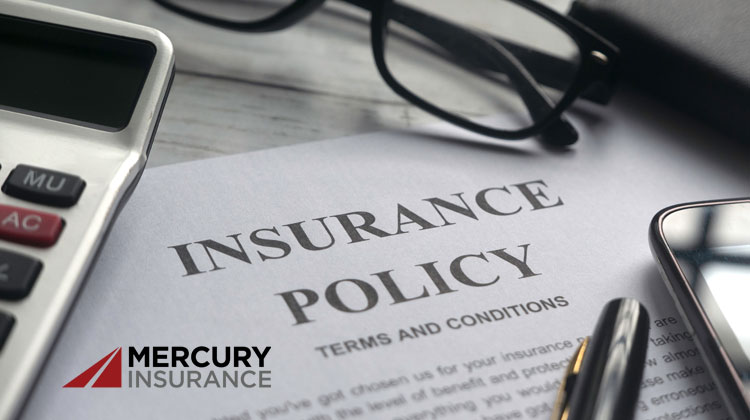Insurance policy document with Mercury Insurance logo, calculator, glasses, and pen on a wooden surface, symbolizing auto repair coverage and claims process at Tropical Collision Center in Miami, FL.